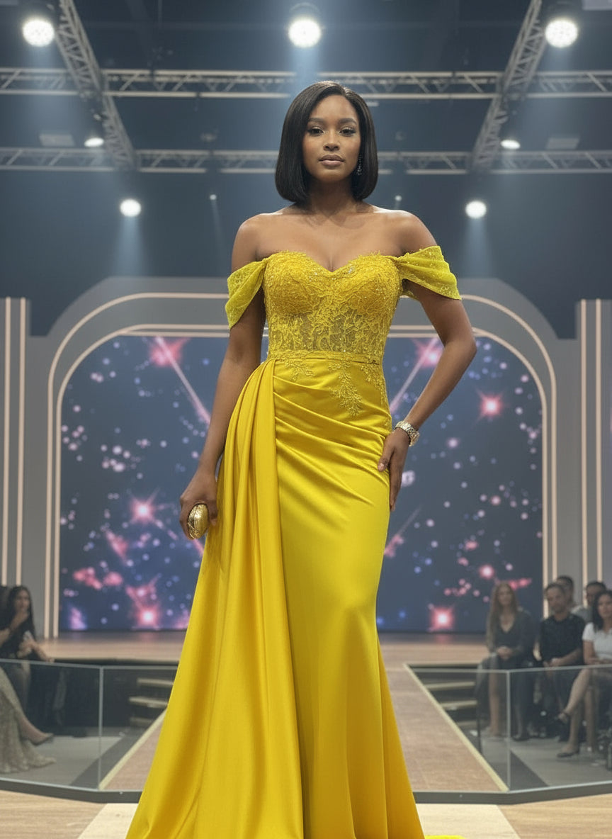 Woman in a bright yellow off-shoulder gown standing on a red platform with a store interior background.